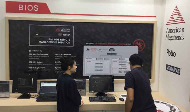 Two people interacting with AMI Bios station