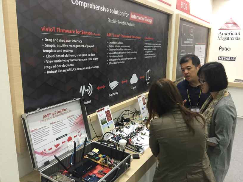 three people interacting with AMI booth