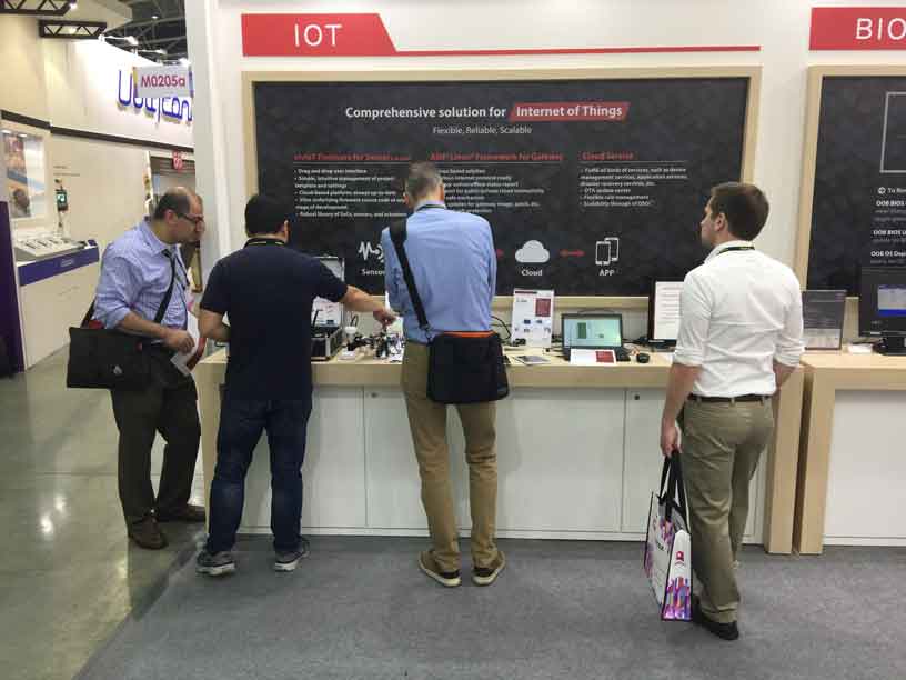 four people interacting with AMI booth